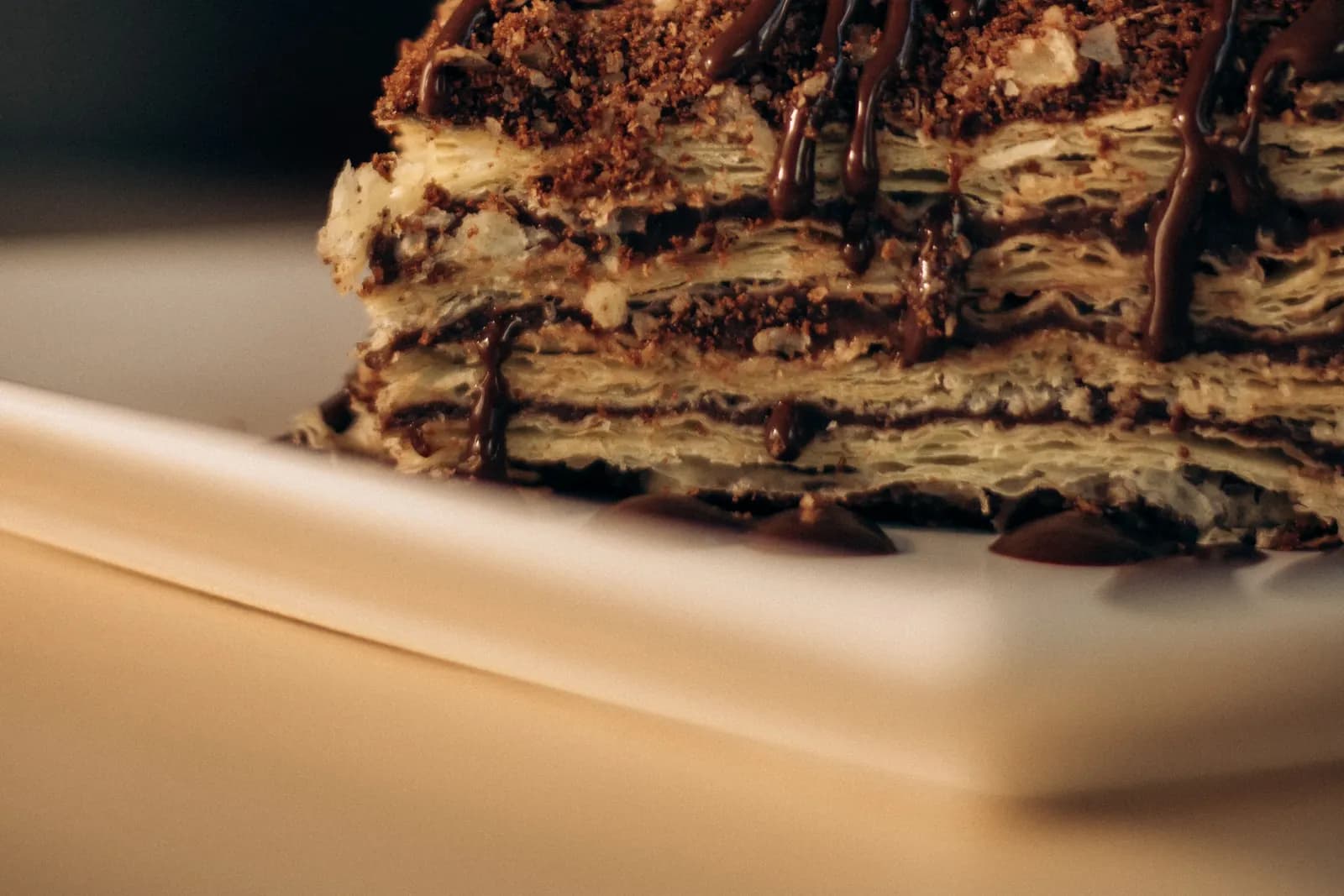 A rich layered chocolate dessert served on a plate
